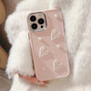 Close-up of 3D pearl heart phone case with pearl and heart design.